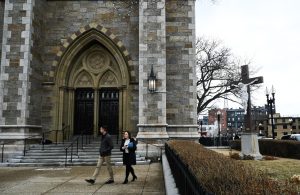  A couple leaves a midday Ash Wednesday blessing at the Cathedral of the Holy Cross Wednesday, March 5. (Photo Izzy Bryars / Beacon Staff)