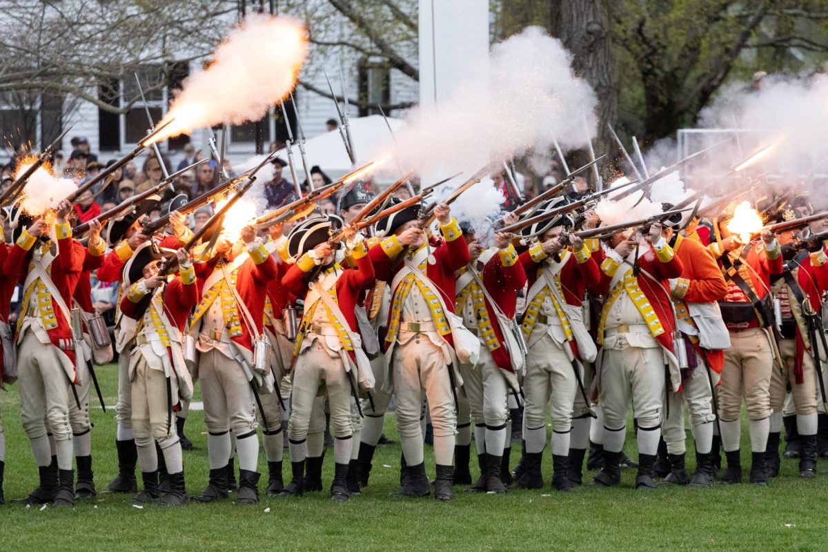 Reenactors fire their weapons on the Lexington Battle Green on Saturday, April, 19, 2025. (Arthur Mansavage/ Beacon Staff)
