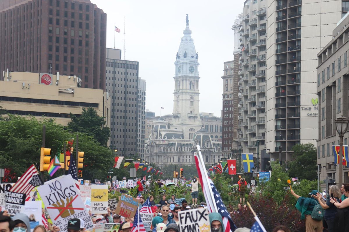 Tens of thousands of protesters march on the shut down Benjamin Franklin Parkway on their way to the Philadelphia Museum of Art during a "No Kings Day," protest on June 14, 2025 (Bryan Hecht / Beacon Staff).  