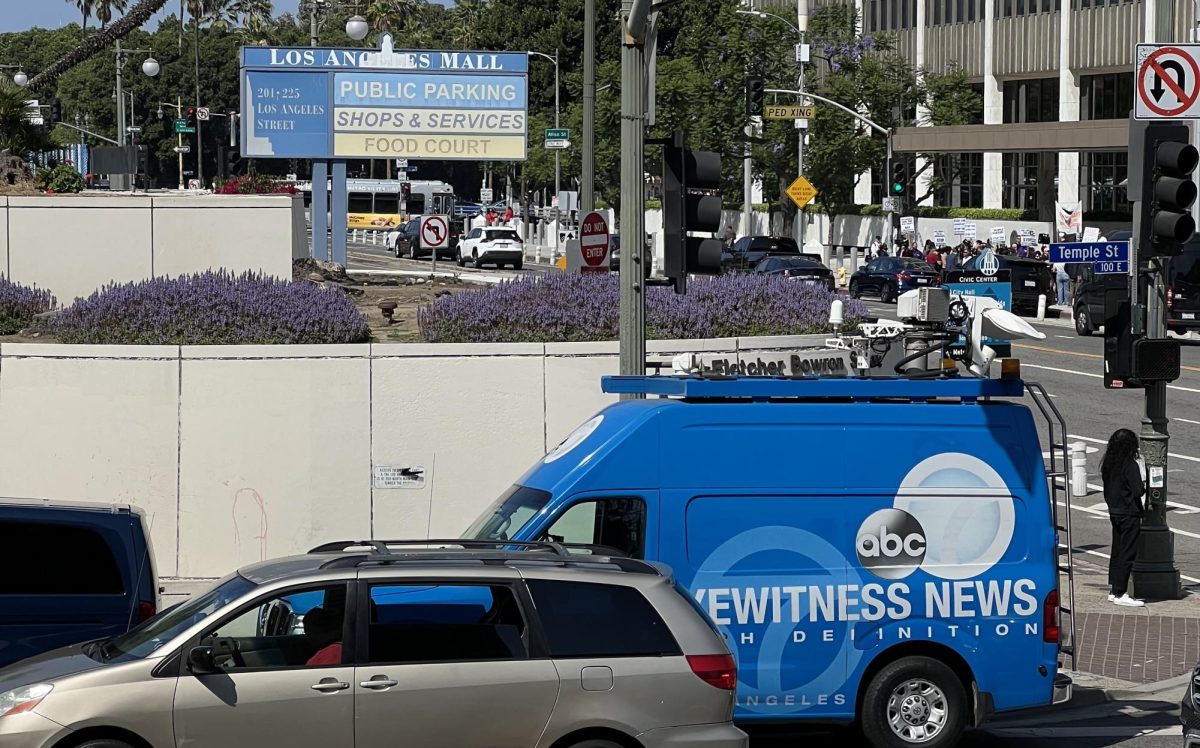 A news van from KABC-TV Los Angeles sits parked around the corner from an anti-ICE protest on June 6, 2025 (Jordan Pagkalinawan/ Beacon Staff).