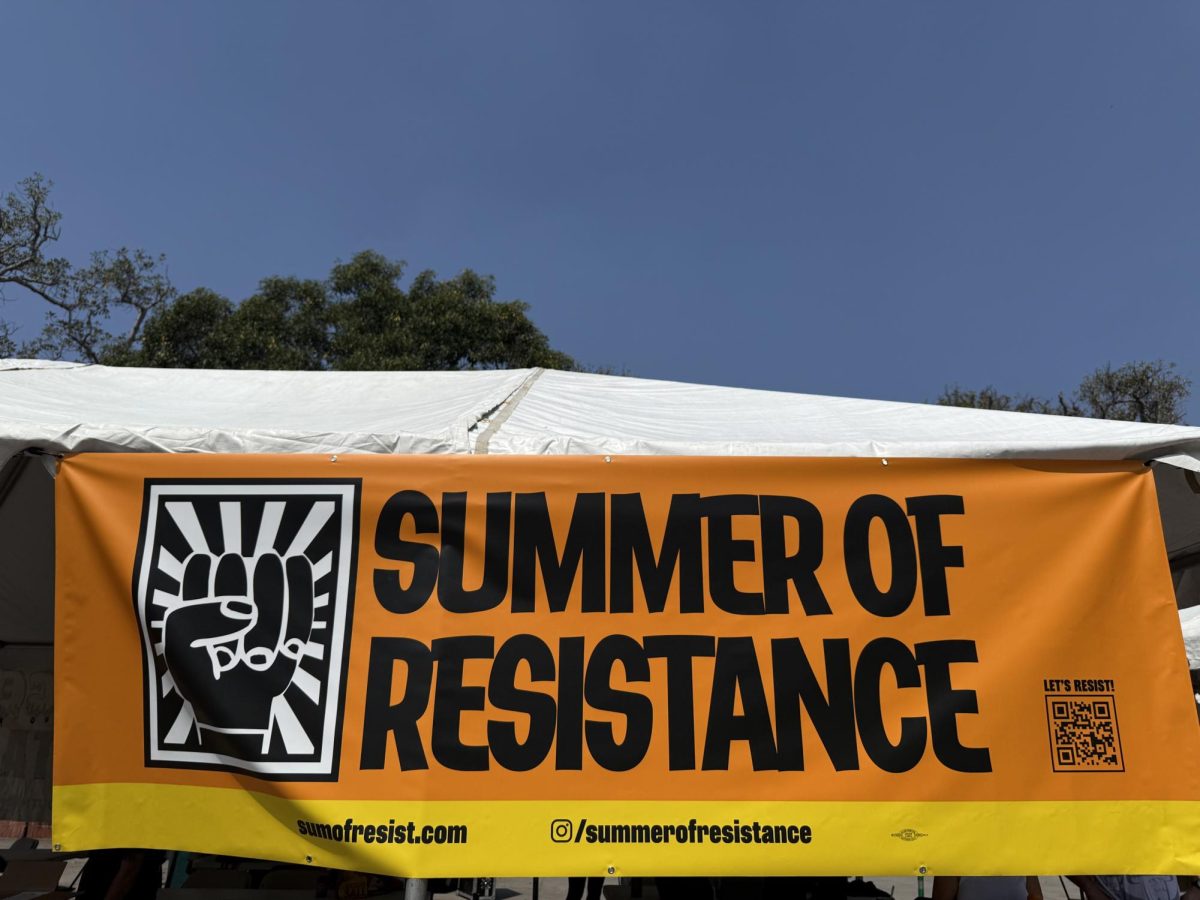 A banner for "Summer of Resistance," which organized the "Run Against ICE" on July 5, 2025 (Jordan Pagkalinawan/ Beacon Staff).