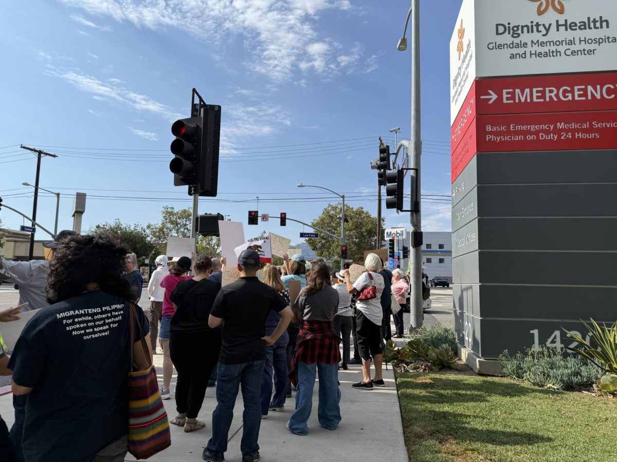 Community members rallied in support of a detained immigrant hospitalized following an encounter with ICE agents. Subcontracted detention officers have monitored the patient for two weeks (Jordan Pagkalinawan/ Beacon Staff).