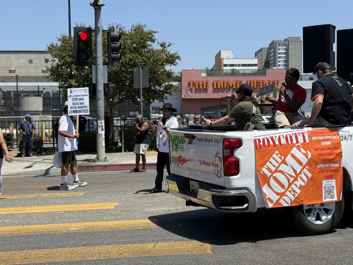A U-Haul pickup truck draped with the message "Boycott Home Depot" led demonstrators at an anti-ICE protest on August 9, 2025 (Jordan Pagkalinawan/ Beacon Staff).