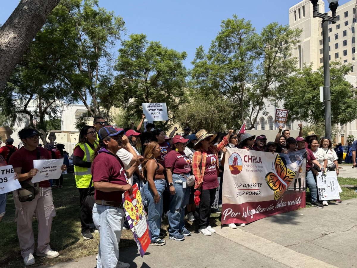 Members of the Coalition for Humane Immigrant Rights of Los Angeles (CHIRLA) pose for photos at MacArthur Park on August 12, 2025 (Jordan Pagkalinawan/ Beacon Staff).