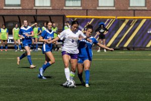 Senior midfielder Linae Bezdek controls the ball against Wheaton College on Sept. 20, 2025 (Jacob Goldberg/ For The Beacon).