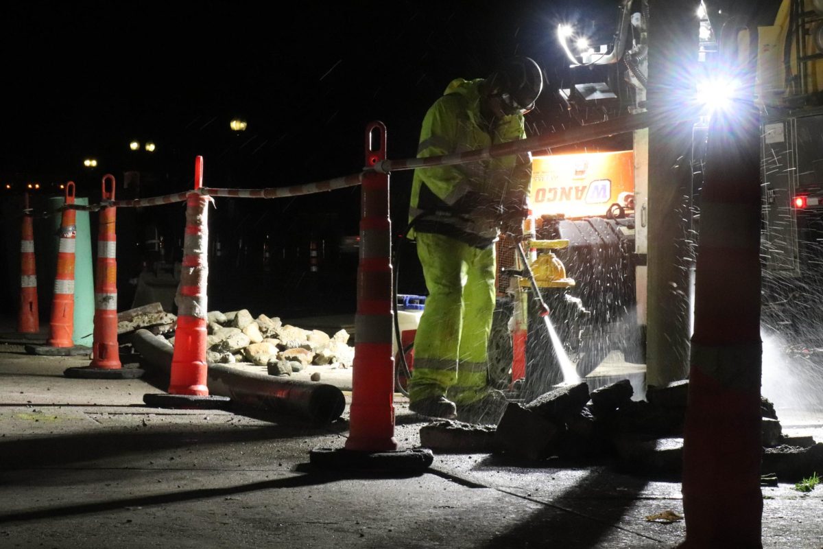 A worker begins preliminary construction for a water main replacement project outside Piano Row on Monday, Sept. 15, 2025. (Bryan Hecht / Beacon Staff)