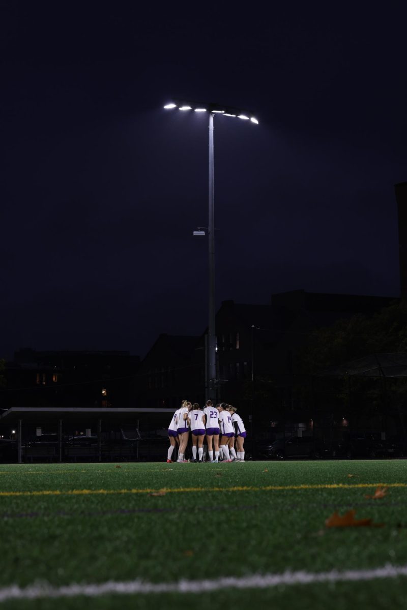 The Emerson women's soccer team huddles against MIT on Wednesday, Oct. 29 (Jacob Goldberg/ Beacon Staff).