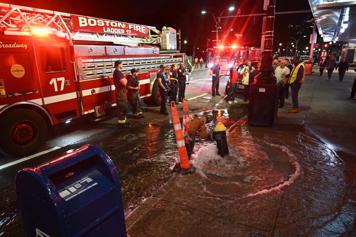Boston Fire Department responds to a busted fire hydrant on Tremont Street outside AMC Boston Common 19, which ECPD confirmed was caused by a collision with a vehicle on Saturday, Oct. 11, 2025. (Bryan Hecht / Beacon Staff)