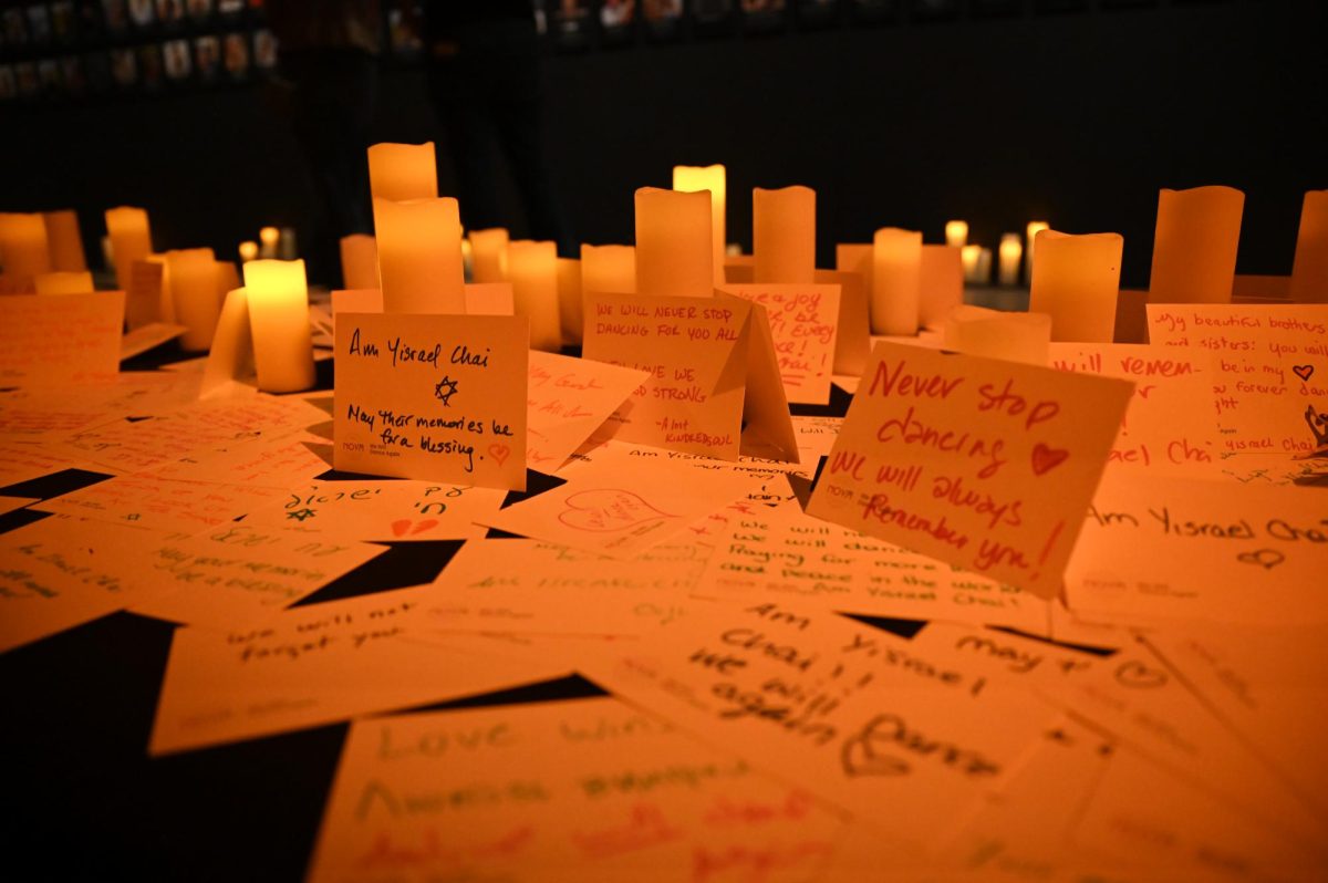 Notes left by visitors at the Nova Exhibition on October 7, 2025 memorializing the lives lost during the Oct. 7 attacks. (Madalyn Jimiera / Beacon Staff)