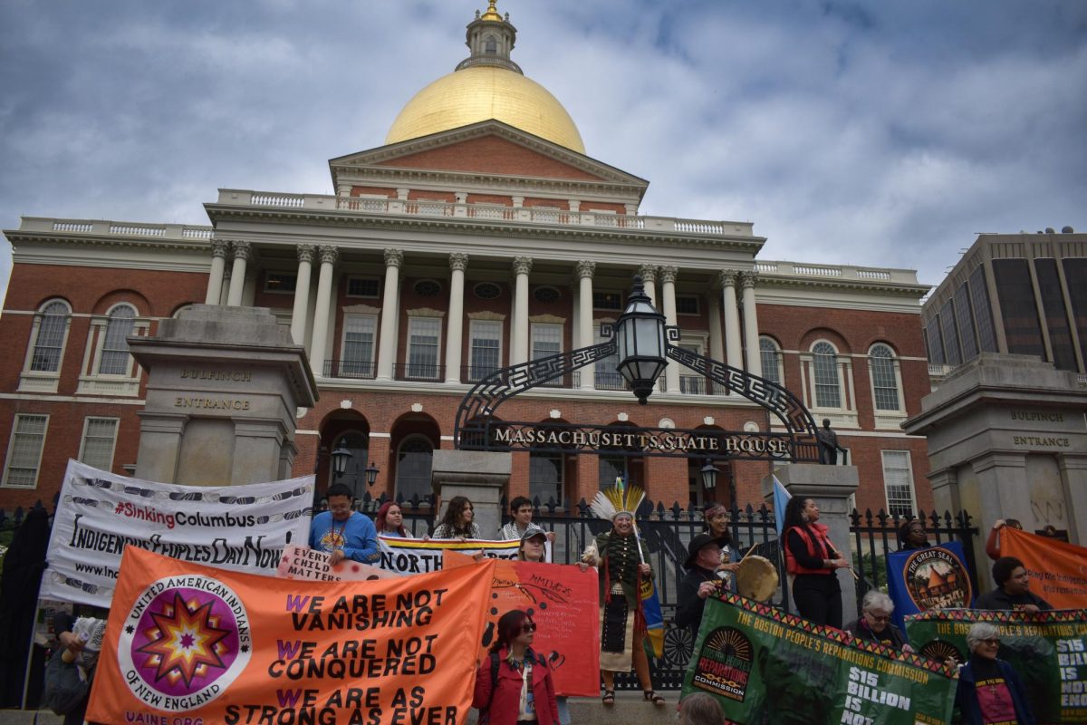Indigenous activists protest in front of the State House on Saturday, Oct. 11, 2025. (Rina Laby / Beacon Staff)