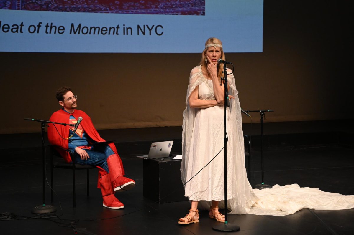 Beth Osnes-Stoedefalke performed a climate comedy piece during the keynote event presented by her and Matt McMann for the Teach-In on Sustainability on Oct. 16, 2025. (Madalyn Jimiera / Beacon Staff)