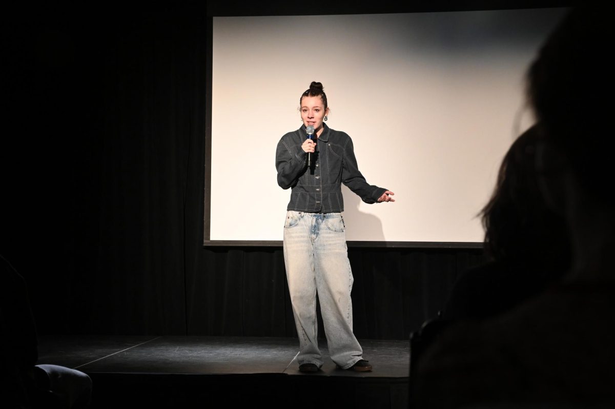 Elizabeth Stone does a stand-up comedy act during the Laughmageddon Comedy Show, the final event of the Teach-In on Sustainability on October 17, 2025. (Madalyn Jimiera / Beacon Staff)