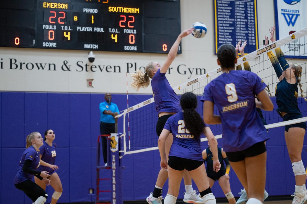 Junior middle hitter Chloe Hokenson (#15) spikes the ball against the University of Southern Maine Huskies on Oct. 4, 2025 (Riley Goldman/ Beacon Staff).
