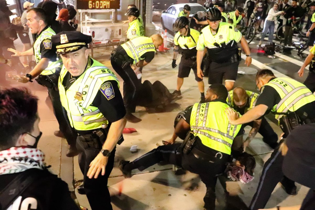 Pro-Palestine protesters are held down and arrested following a demonstration on Tuesday, Oct. 7, 2025. (Bryan Hecht / Beacon Staff)