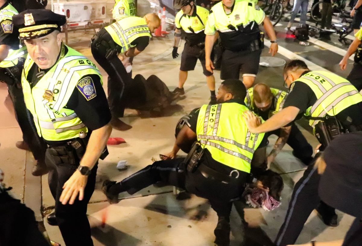 Pro-Palestine protesters are held down and arrested following a demonstration on Tuesday, Oct. 7, 2025. (Bryan Hecht / Beacon Staff)