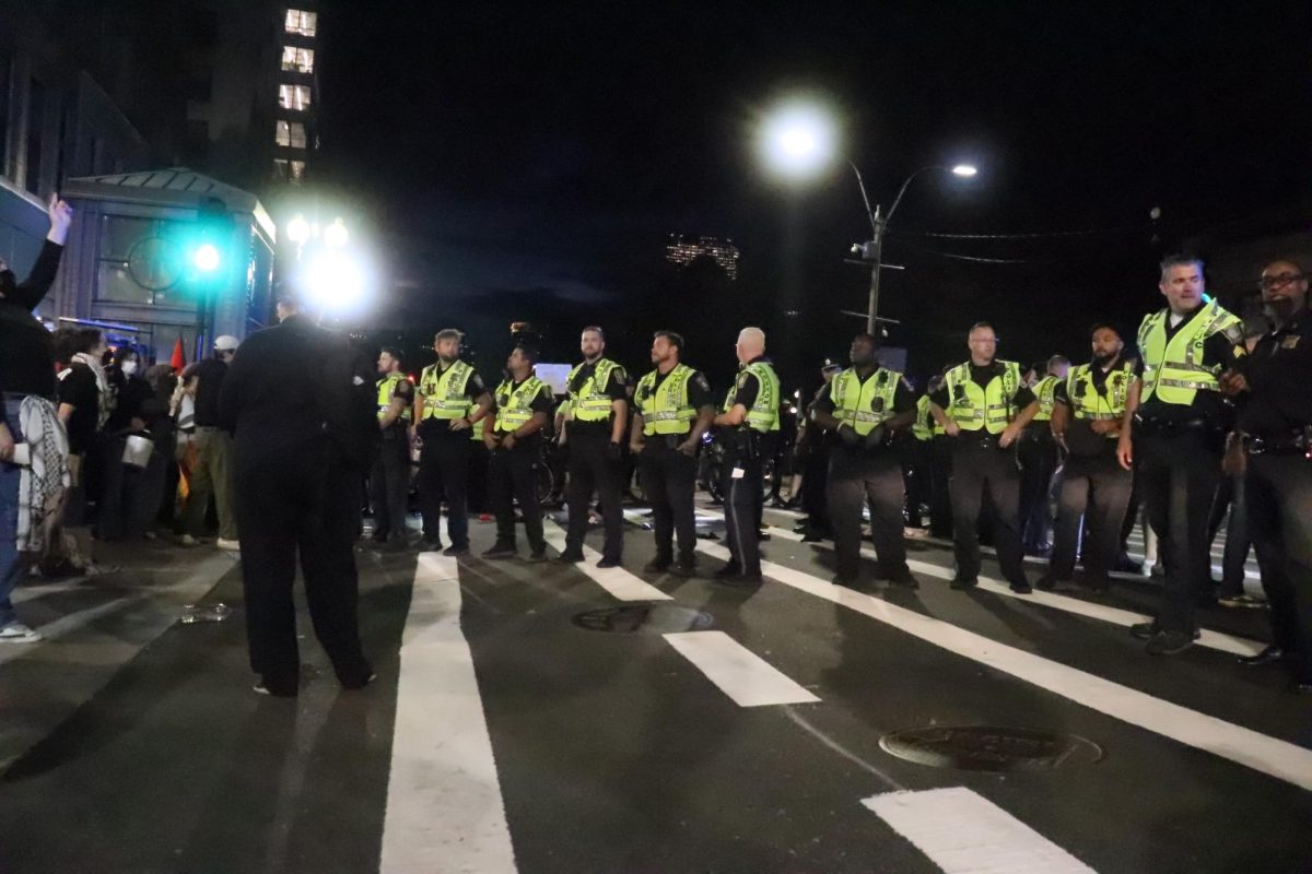 Officers form a blockade preventing protesters from crossing Tremont Street while others are arrested after a Pro-Palestine protest on Tuesday, Oct. 7, 2025. (Bryan Hecht / Beacon Staff)
