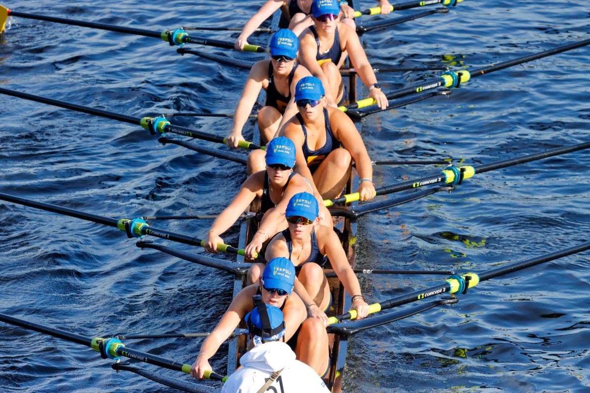 Rowers on the water during a race Sunday morning at the Head of The Charles Regatta. (Arthur Mansavage/ Beacon Staff)