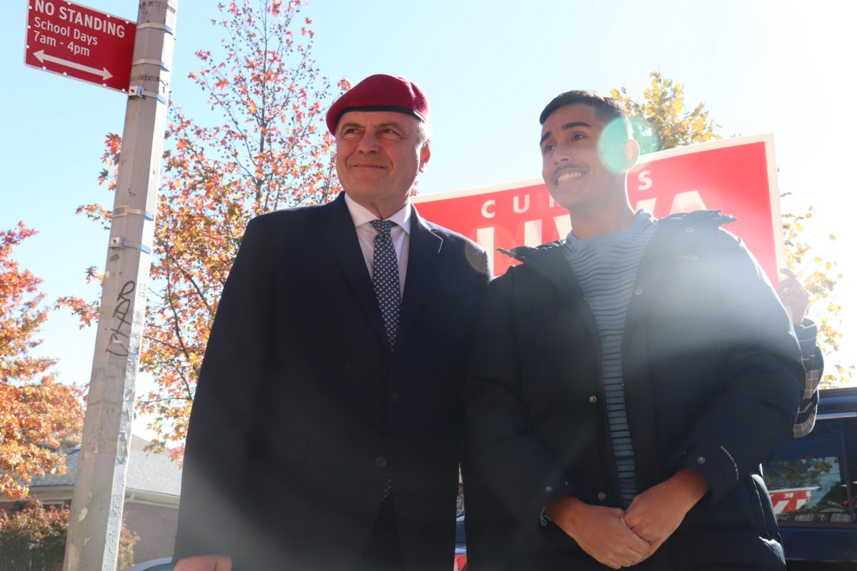 Curtis Sliwa takes pictures with supporters outside a polling location in Whitestone Queens, New York on election day Tuesday, Nov. 4, 2025. (Bryan Hecht / Beacon Staff)