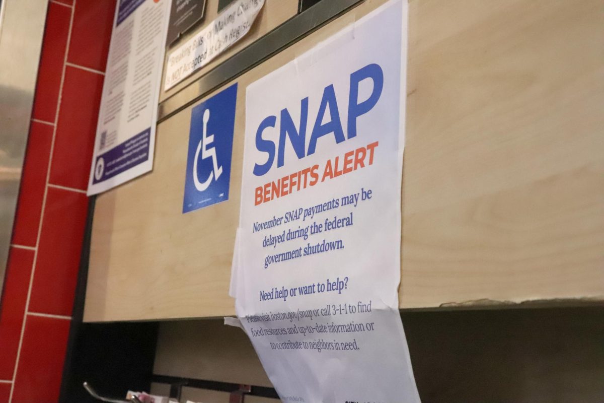 A sign alerts customers of November SNAP benefit shortages in Roche Bros. in Downtown Crossing. (Bryan Hecht / Beacon Staff)