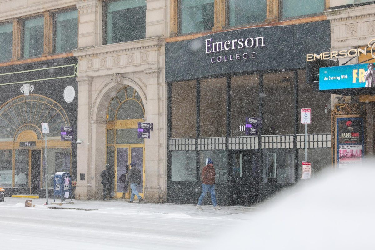 Snow falling on Boylston Street outside of the Emerson College visitor center on Sunday, Jan. 25, 2026. (Arthur Mansavage/ Beacon Staff)