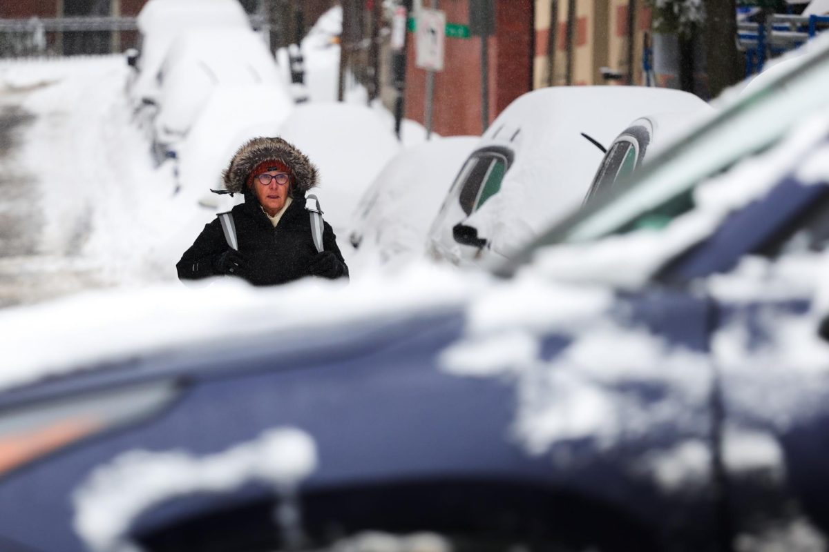 A person walking on the street in Beacon Hill on Monday, Jan. 26, 2026. (Arthur Mansavage/ Beacon Staff)