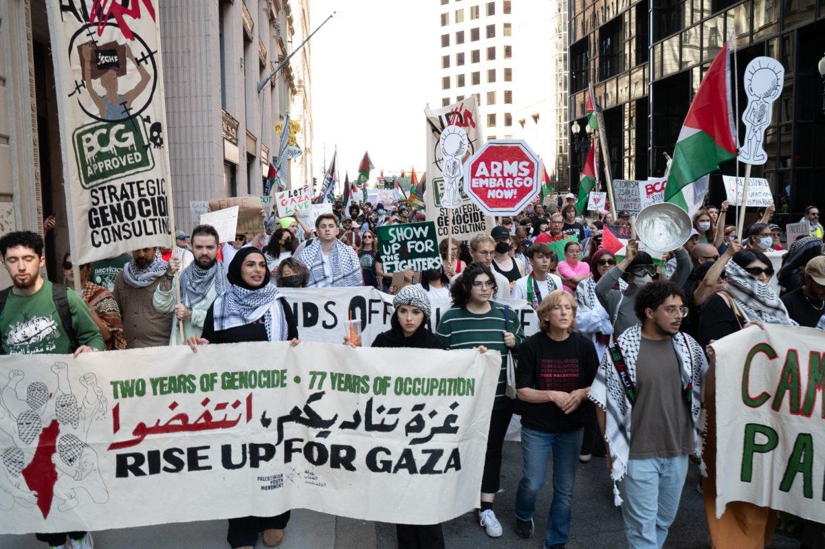 Pro-Palestine protesters march down Congress Street in Boston on Oct. 5, 2025. (Riley Goldman/Beacon Staff)
