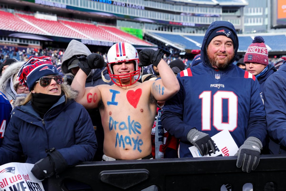 A shirtless fan with body paint that says “I heart Drake Maye” on Sunday, Feb. 1, 2026. (Arthur Mansavage/ Beacon Staff) 