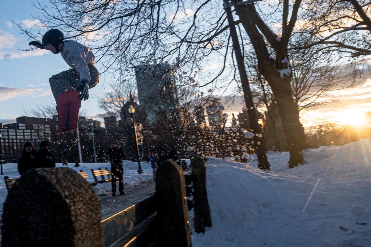 Snowboarders and skiers created makeshift jumps, using Boston Common benches as support. Tue. 24, 2025, (Nick Peace/Beacon Staff)